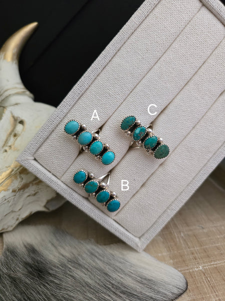 THE JOHN McCRAY FOUR TURQUOISE STONE RING