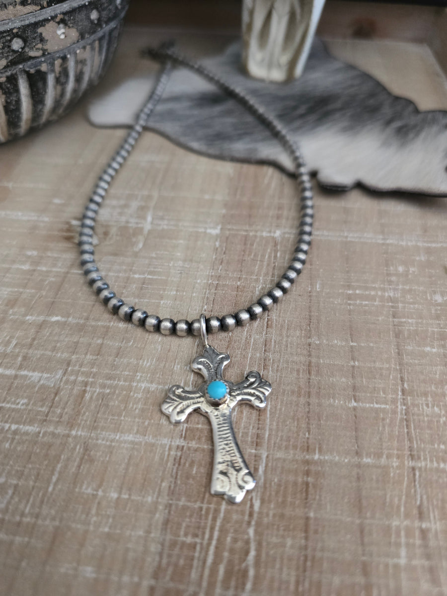 PAULINE NELSON STERLING SILVER AND TURQUOISE CROSS PENDANT