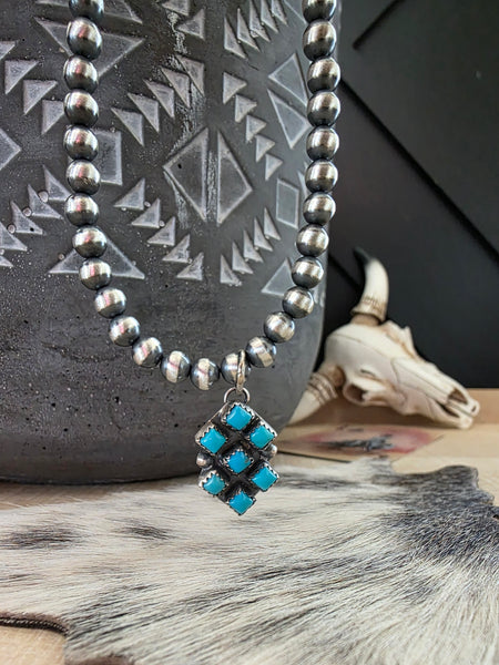 PAULINE NELSON KINGMAN SEVEN STONE TURQUOISE PENDANT