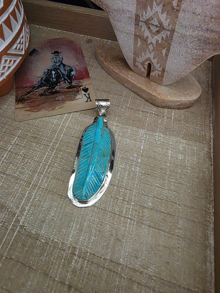 CARVED TURQUOISE FEATHER PENDANT