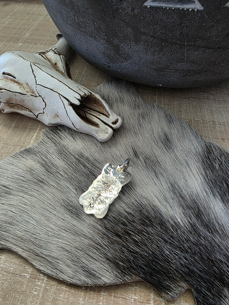 PAULINE NELSON STERLING SILVER BOW PENDANT