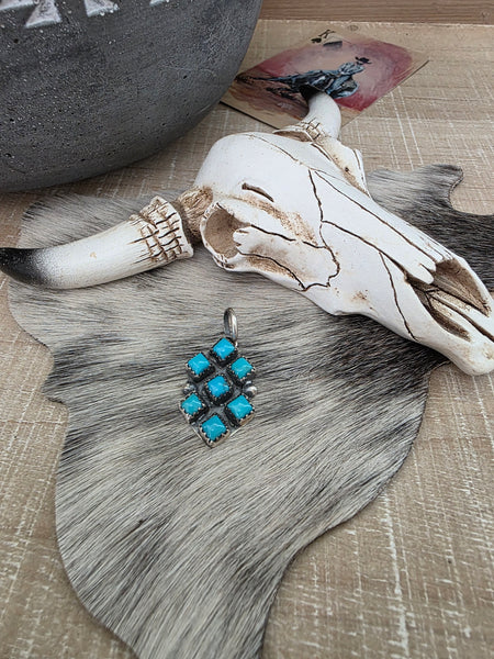 PAULINE NELSON KINGMAN SEVEN STONE TURQUOISE PENDANT