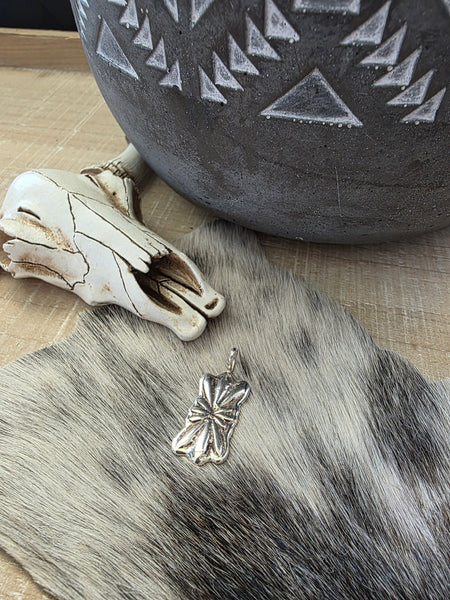 PAULINE NELSON STERLING SILVER BOW PENDANT