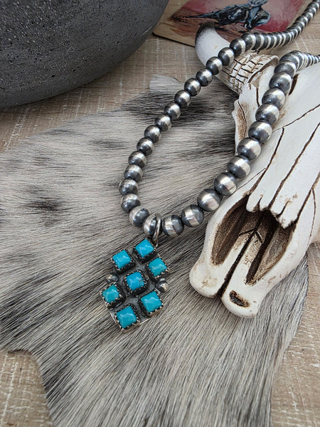 PAULINE NELSON KINGMAN SEVEN STONE TURQUOISE PENDANT